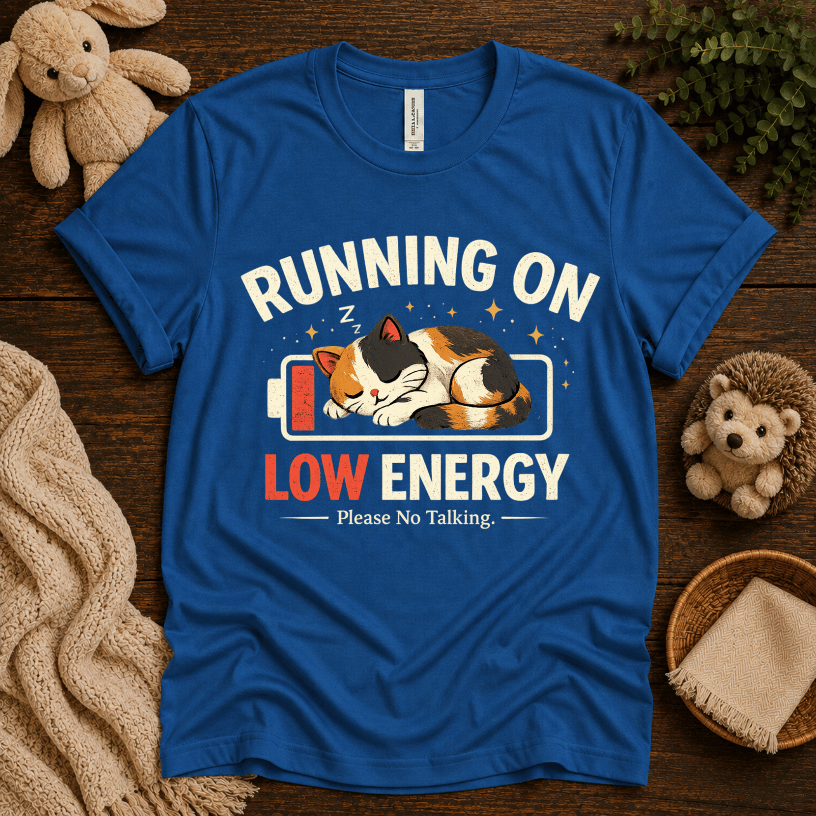 Low Energy Cat cute animal graphic t-shirt cozy flat lay in true royal.