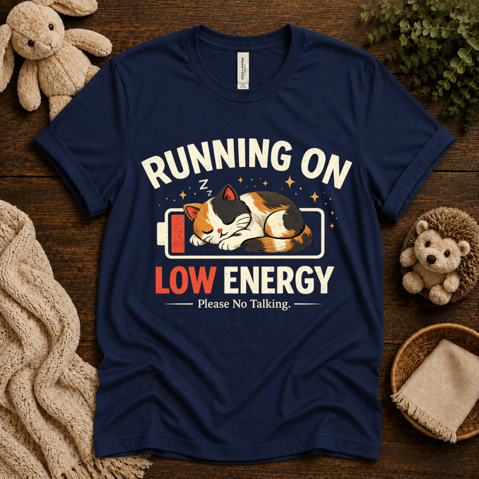 Low Energy Cat cute animal graphic t-shirt cozy flat lay in navy.
