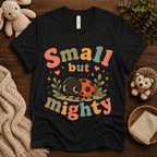 Small But Mighty cute animal graphic t-shirt cozy flat lay in vintage black.