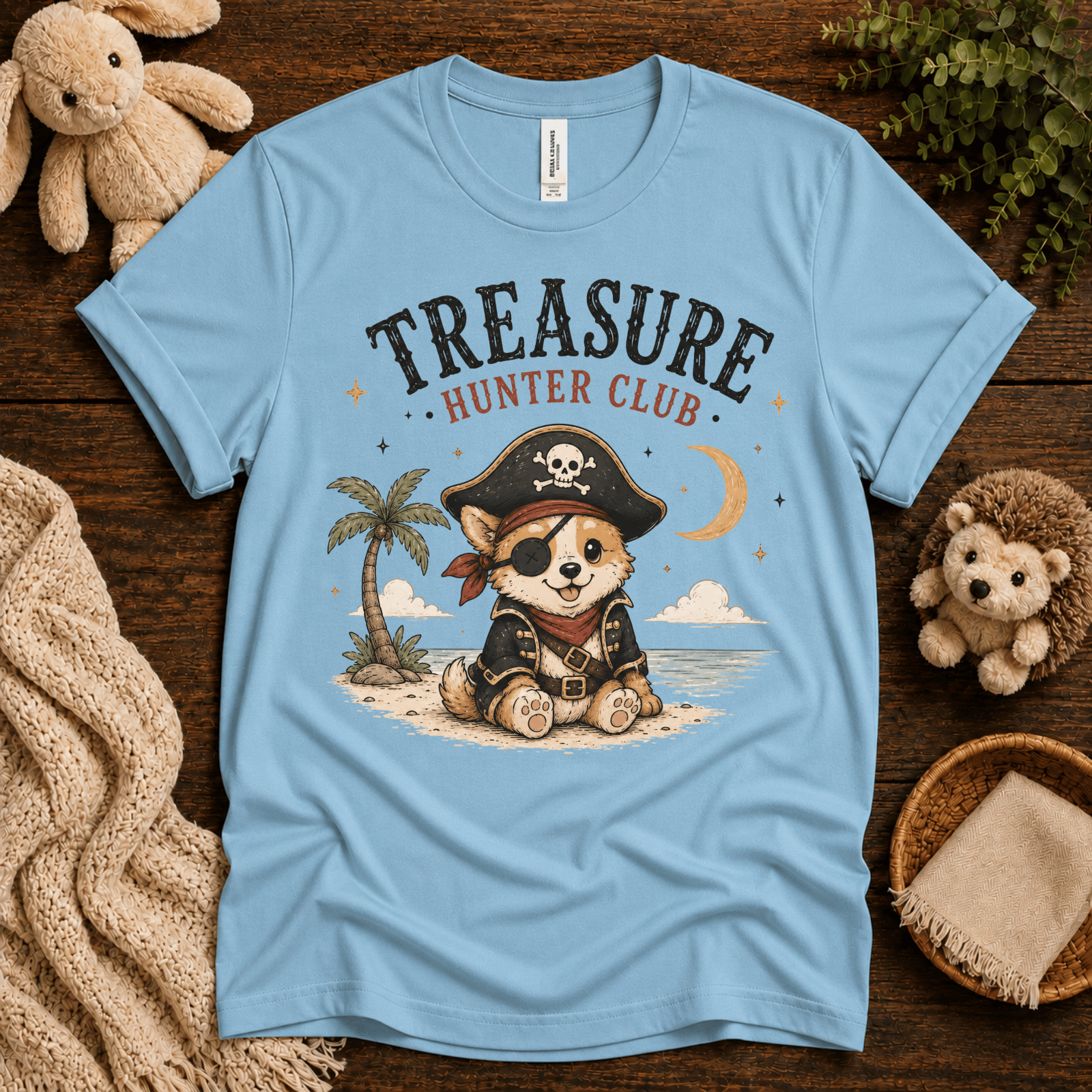 Treasure Hunter Club cute animal graphic t-shirt cozy flat lay in baby blue.