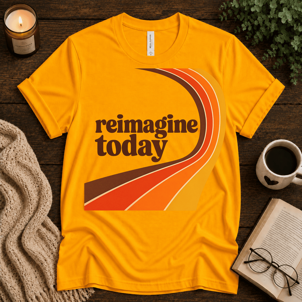 Reimagine Today inspirational introvert graphic t-shirt cozy flat lay in gold.