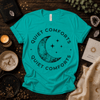 Quiet Comfort black print celestial  graphic t-shirt cozy flat lay in heather sea green.