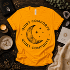 Quiet Comfort black print celestial  graphic t-shirt cozy flat lay in gold.