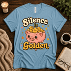 Silence Is Golden funny introvert graphic t-shirt cozy flat lay in baby blue.
