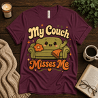 My Couch Misses Me funny introvert graphic t-shirt cozy flat lay in maroon.