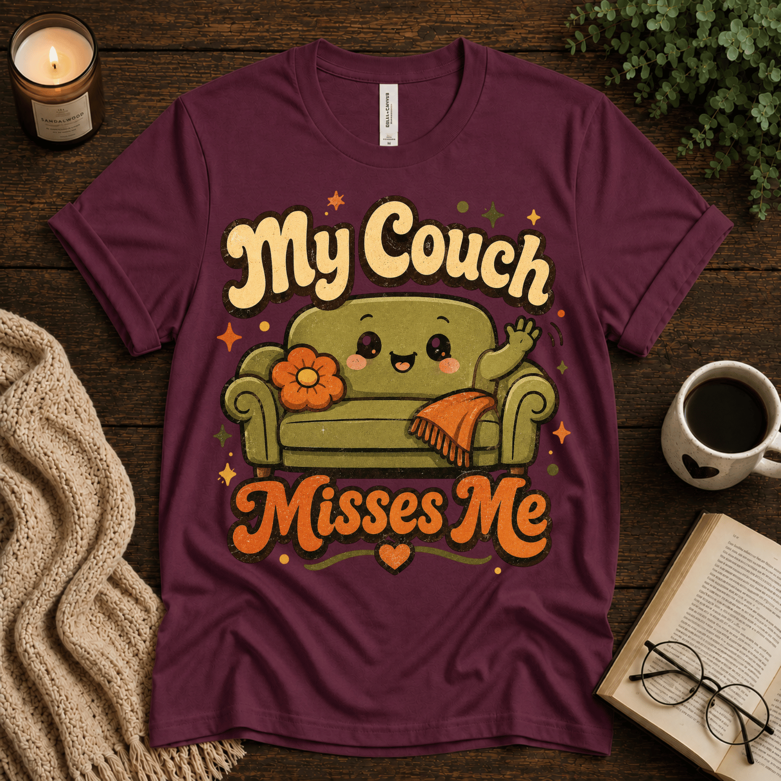 My Couch Misses Me funny introvert graphic t-shirt cozy flat lay in maroon.