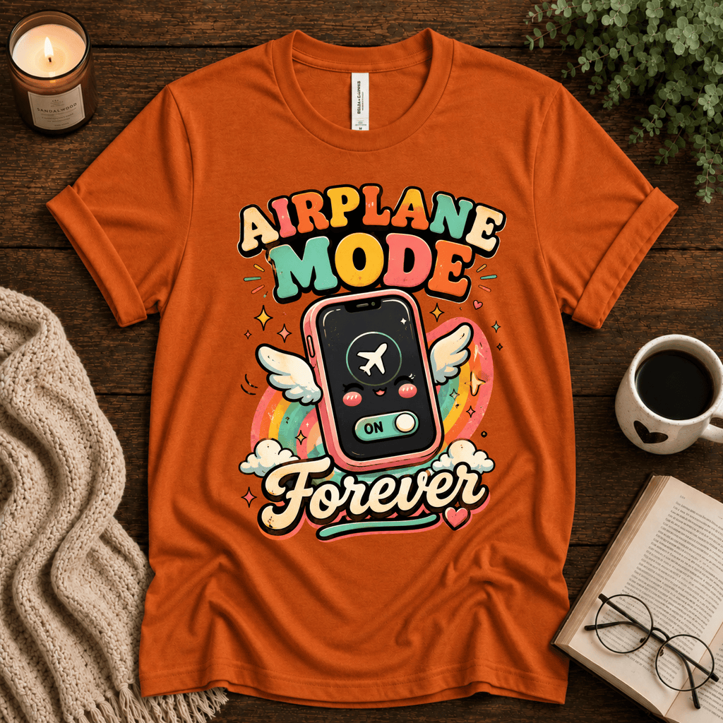 Airplane Mode funny introvert graphic t-shirt cozy flat lay in burnt orange.