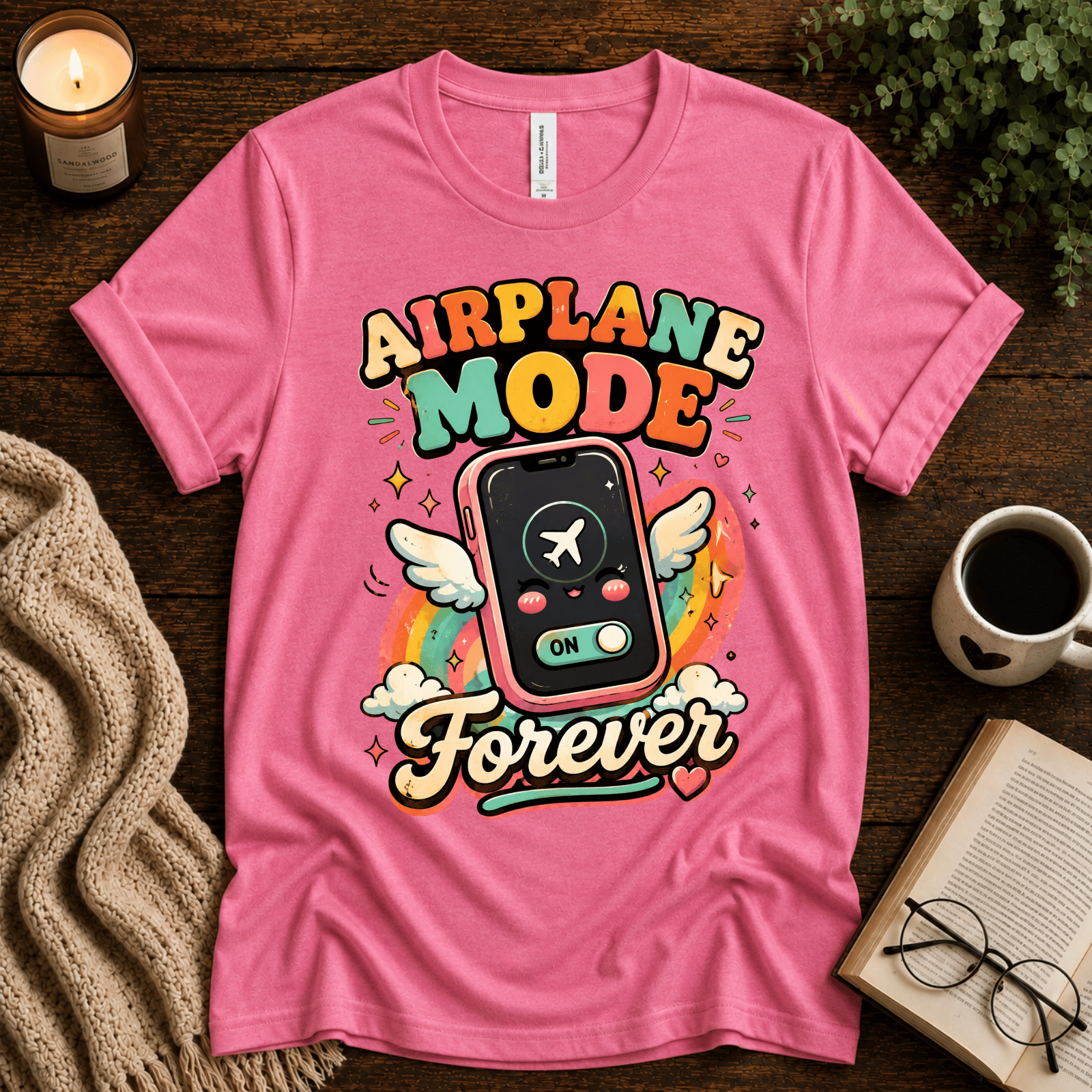 Airplane Mode funny introvert graphic t-shirt cozy flat lay in charity pink.
