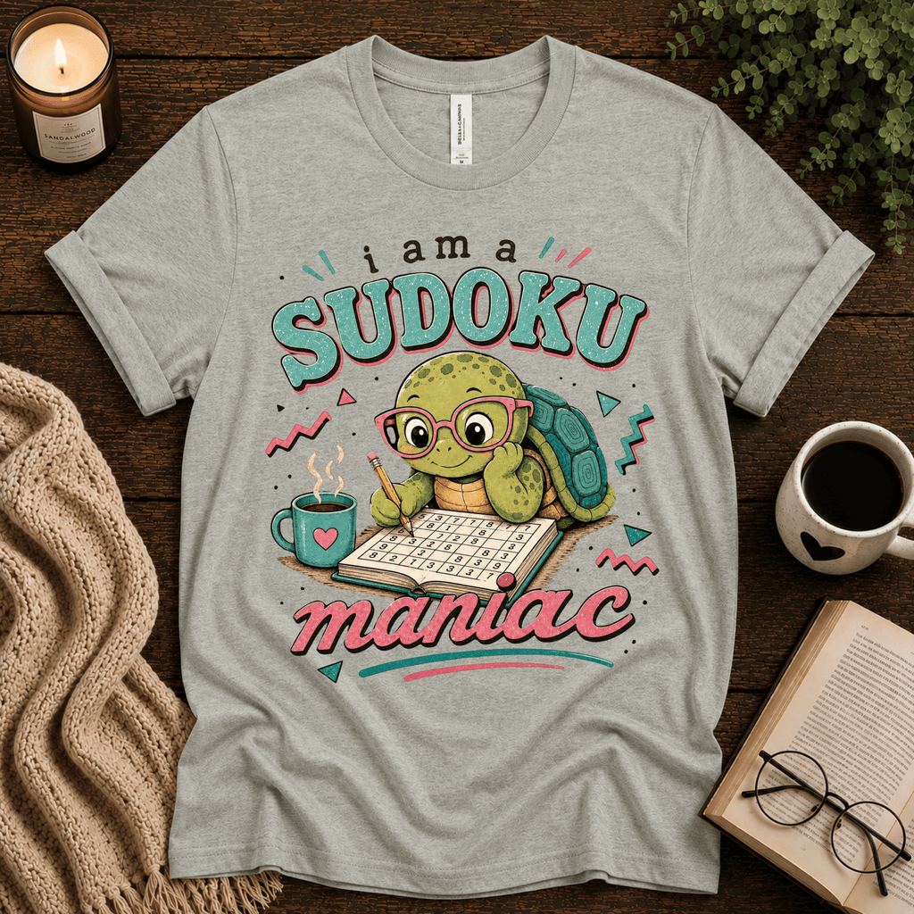 Sudoku Maniac funny introvert graphic t-shirt cozy flat lay in athletic heather.