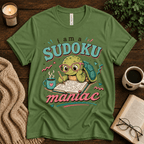 Sudoku Maniac funny introvert graphic t-shirt cozy flat lay in leaf.