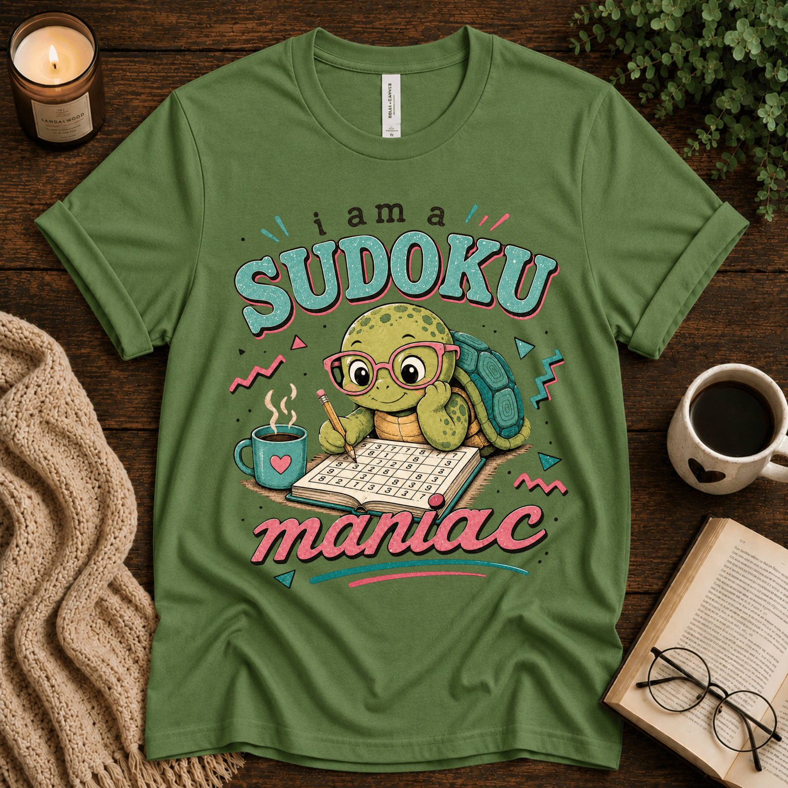 Sudoku Maniac funny introvert graphic t-shirt cozy flat lay in leaf.