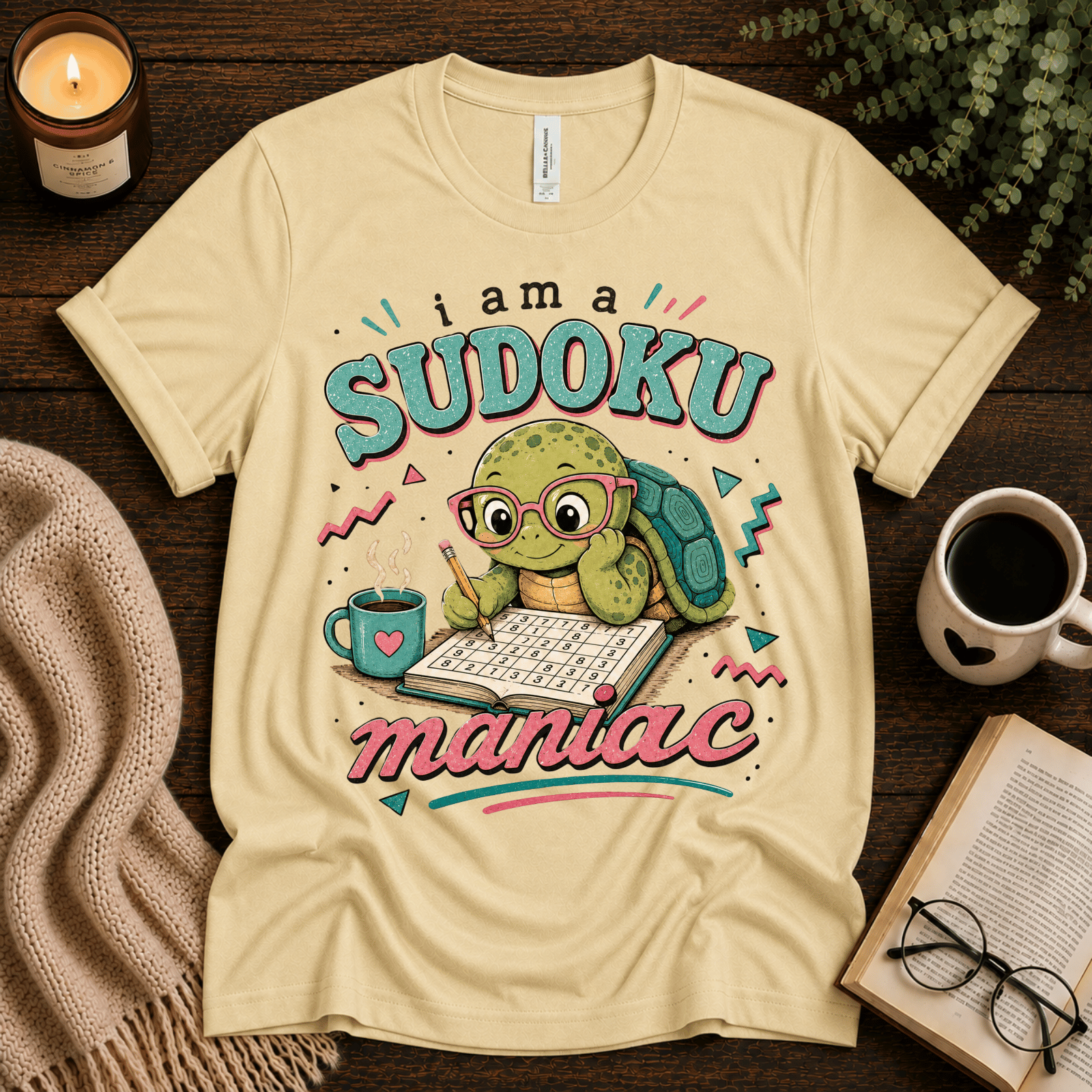 Sudoku Maniac funny introvert graphic t-shirt cozy flat lay in natural.
