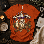 Moonlight Society cute celestial graphic t-shirt cozy flat lay in burnt orange.