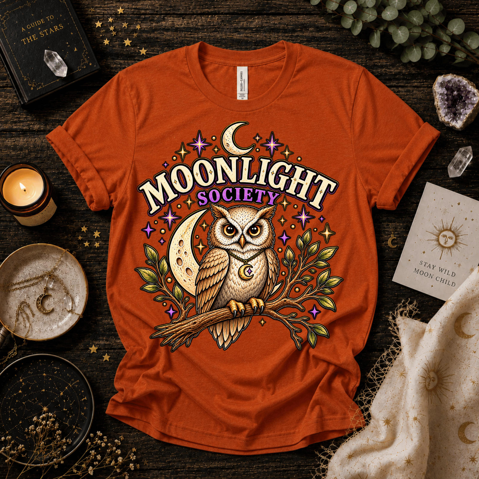 Moonlight Society cute celestial graphic t-shirt cozy flat lay in burnt orange.