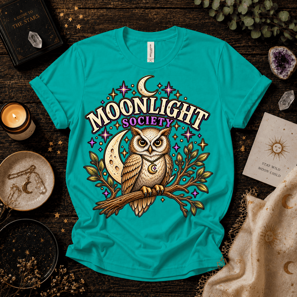 Moonlight Society cute celestial graphic t-shirt cozy flat lay in heather sea green.