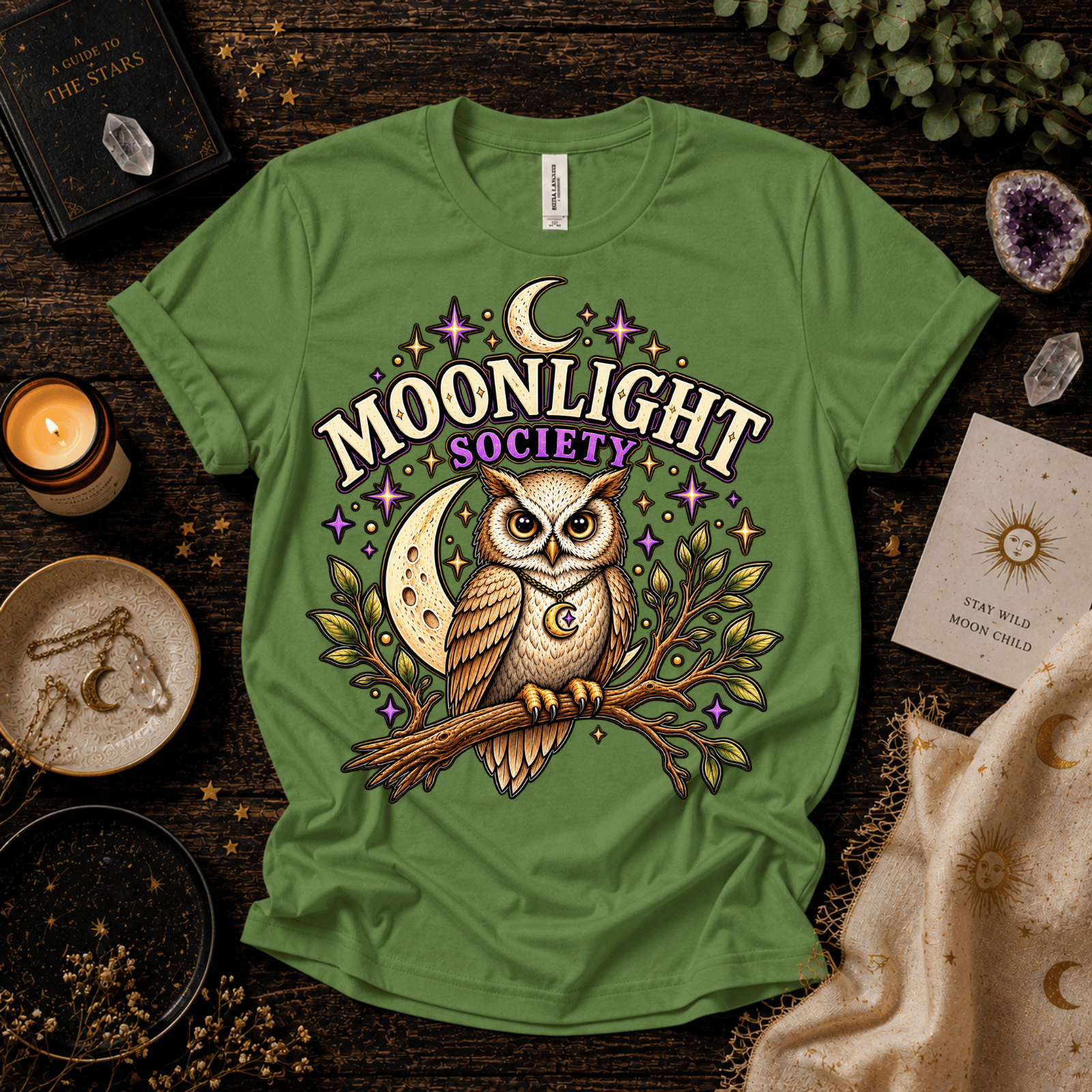 Moonlight Society cute celestial graphic t-shirt cozy flat lay in leaf.