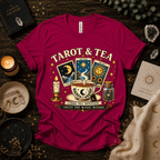 Tarot & Tea celestial tarot graphic t-shirt cozy flat lay in berry.