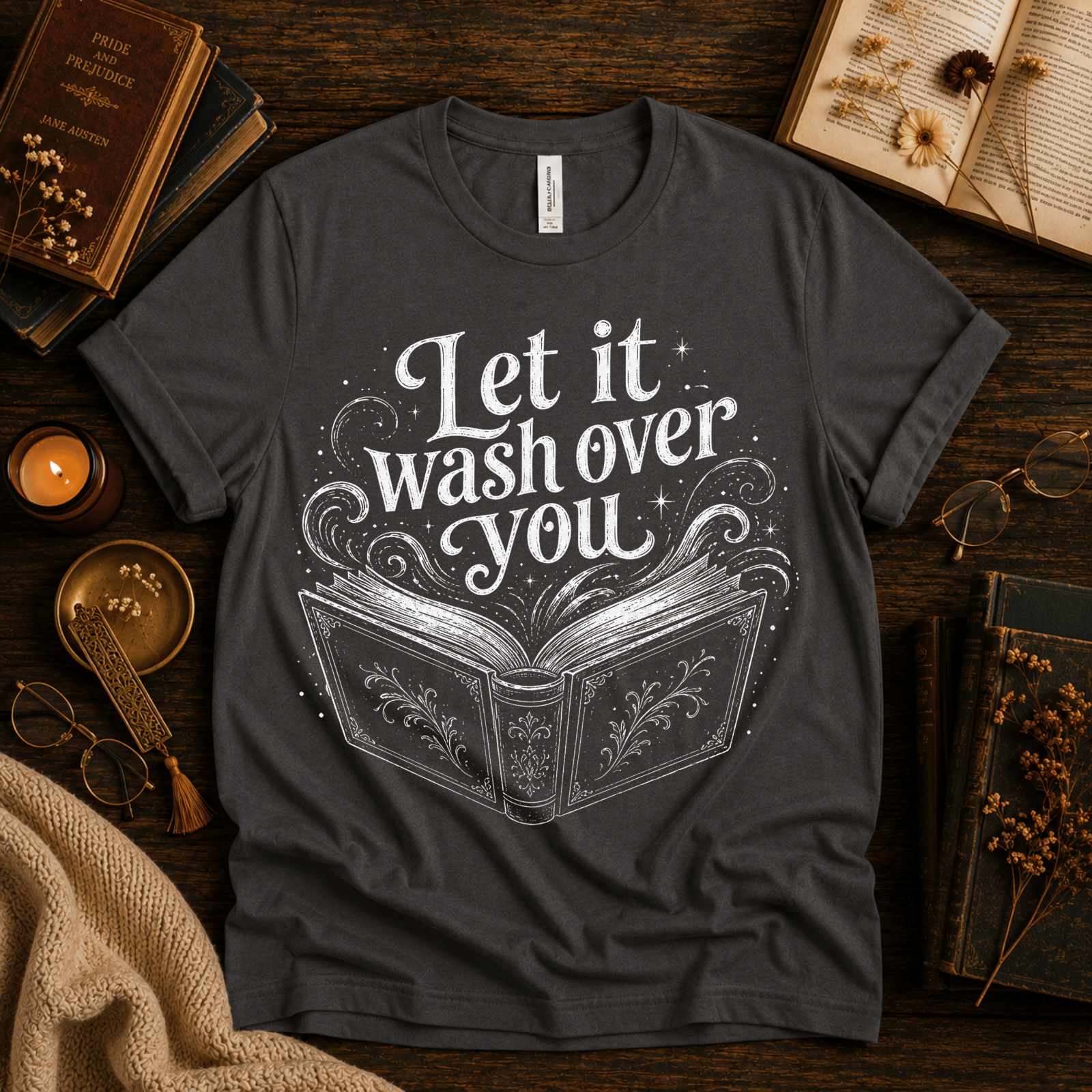 Let It Wash Over You whimsical book graphic t-shirt cozy flat lay in asphalt.