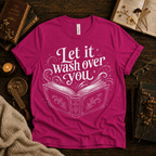 Let It Wash Over You whimsical book graphic t-shirt cozy flat lay in charity pink.
