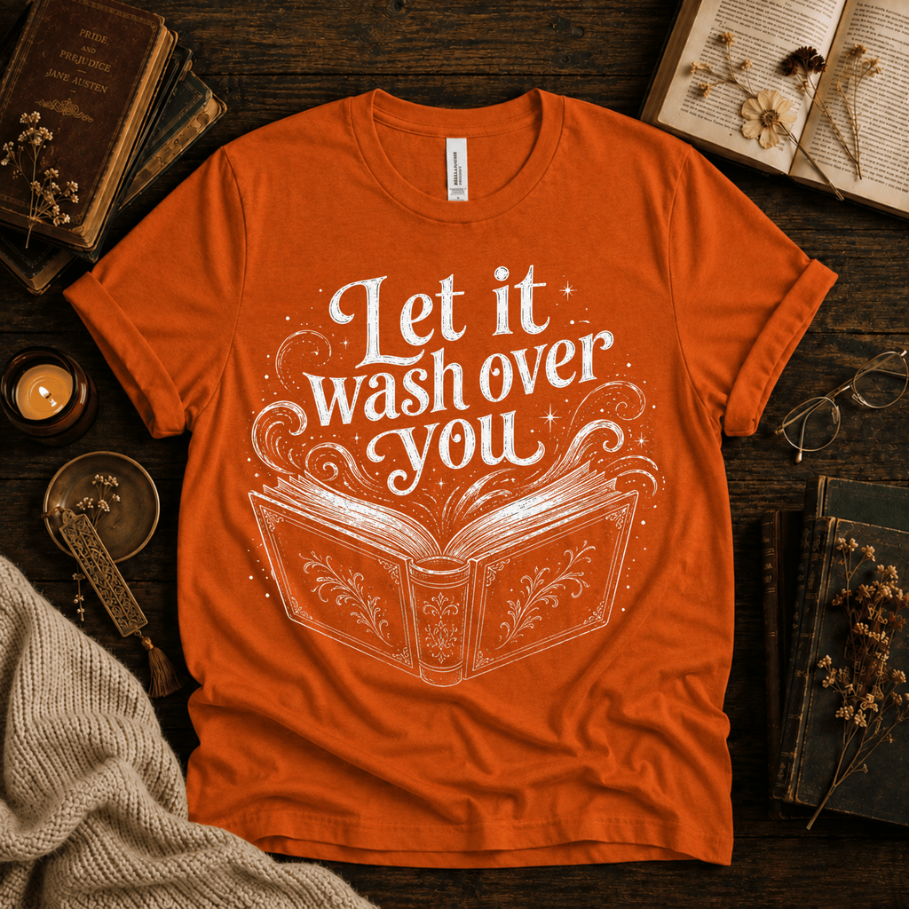 Let It Wash Over You whimsical book graphic t-shirt cozy flat lay in burnt orange.