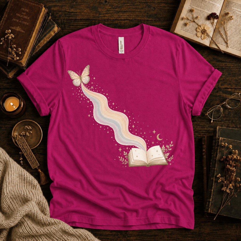 Rainbow Book whimsical book graphic t-shirt cozy flat lay in charity pink.