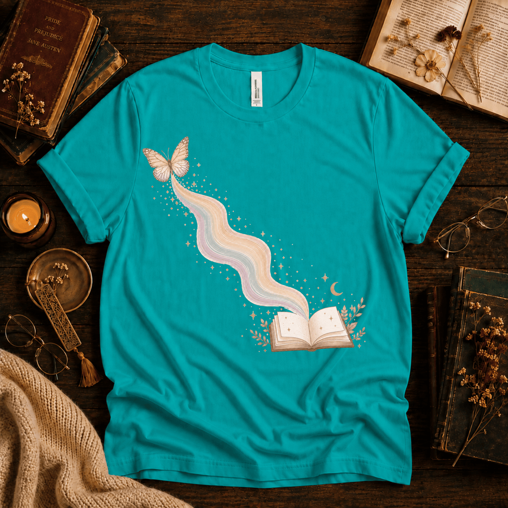 Rainbow Book whimsical book graphic t-shirt cozy flat lay in heather sea green.
