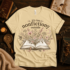 Nonfictiony whimsical book graphic t-shirt cozy flat lay in natural.