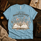 Nonfictiony whimsical book graphic t-shirt cozy flat lay in baby blue.