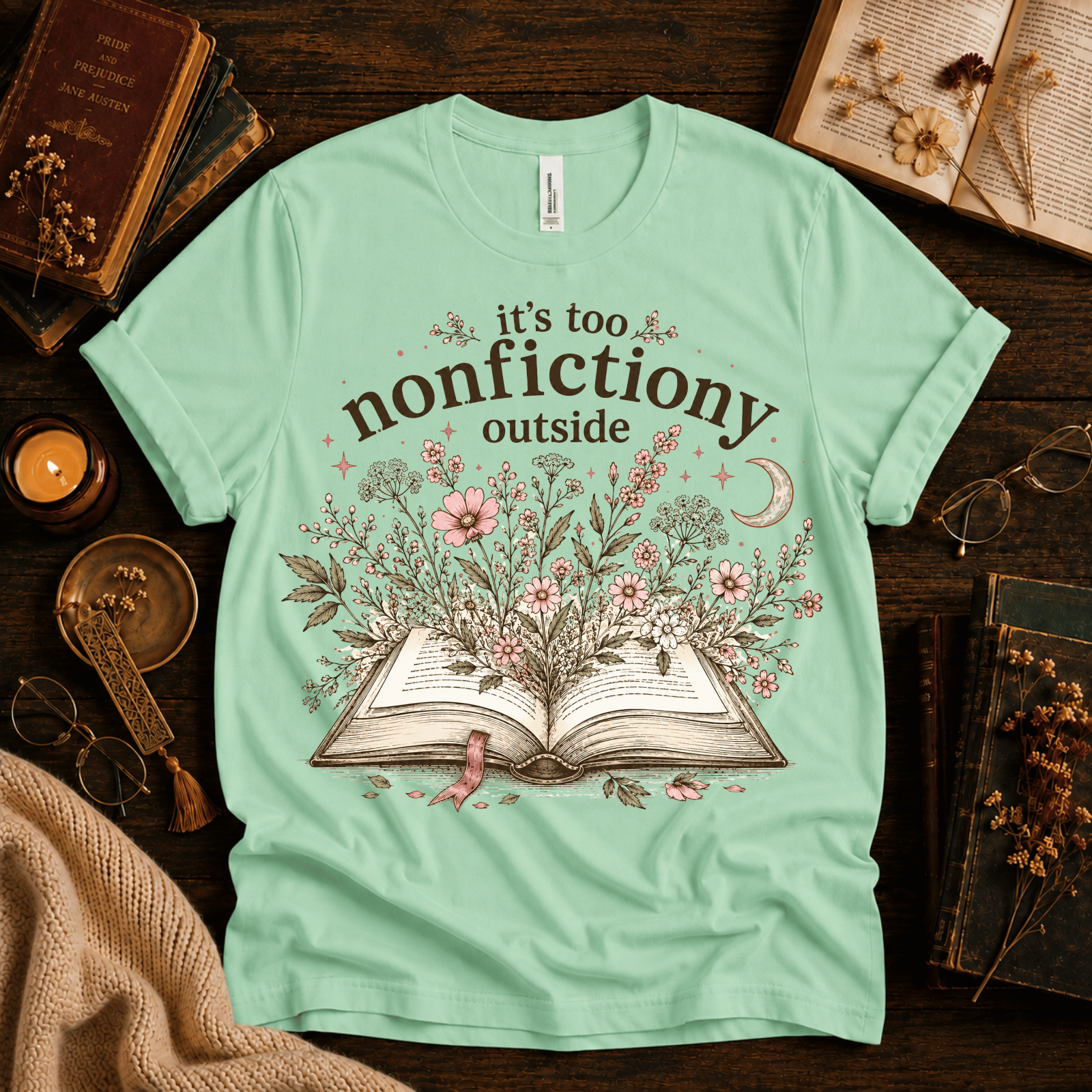 Nonfictiony whimsical book graphic t-shirt cozy flat lay in mint.