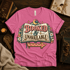 Booked & Unavailable cute book graphic t-shirt cozy flat lay in charity pink.