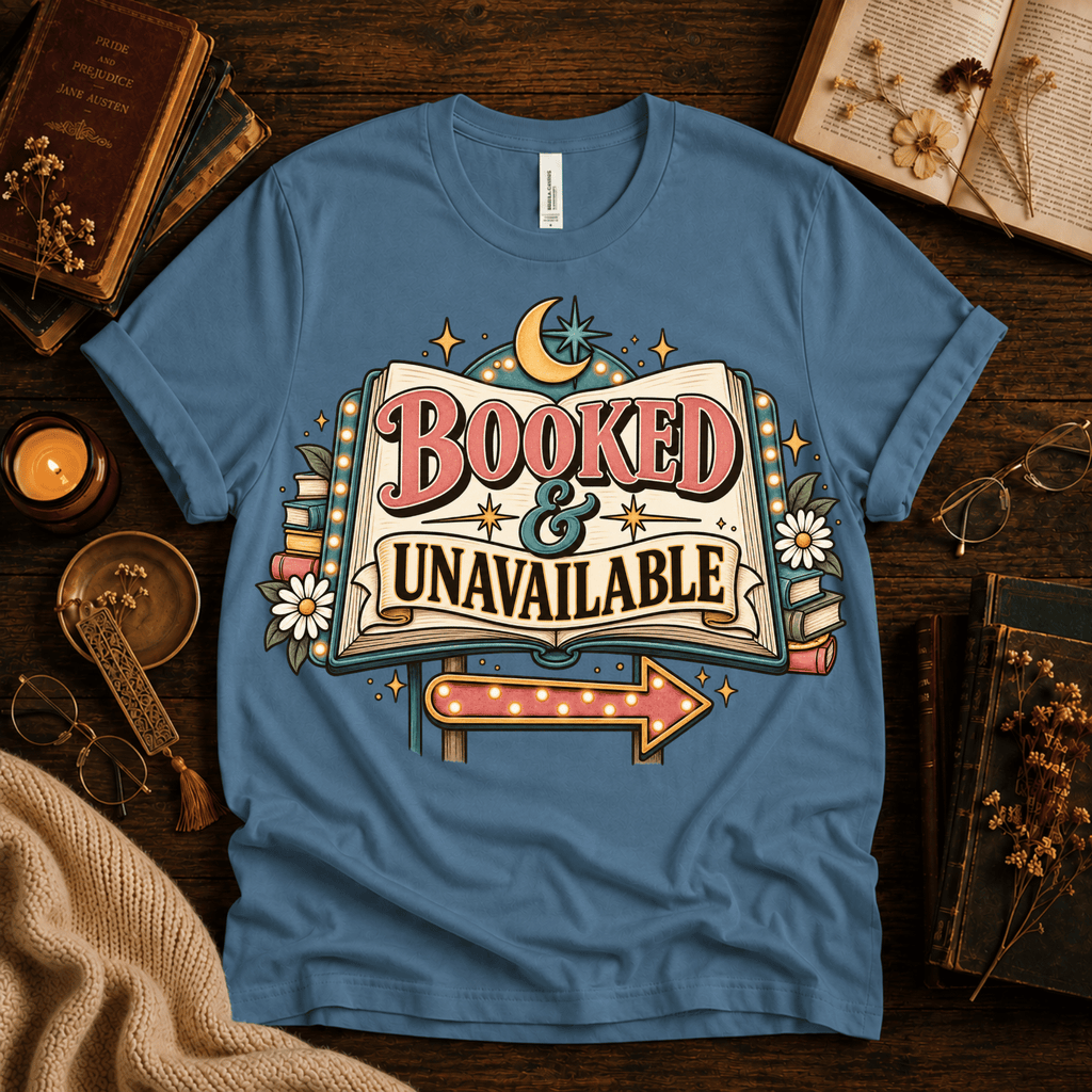 Booked & Unavailable cute book graphic t-shirt cozy flat lay in steel blue.