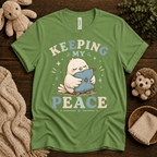 Keeping My Peace cute animal graphic t-shirt cozy flat lay in leaf.