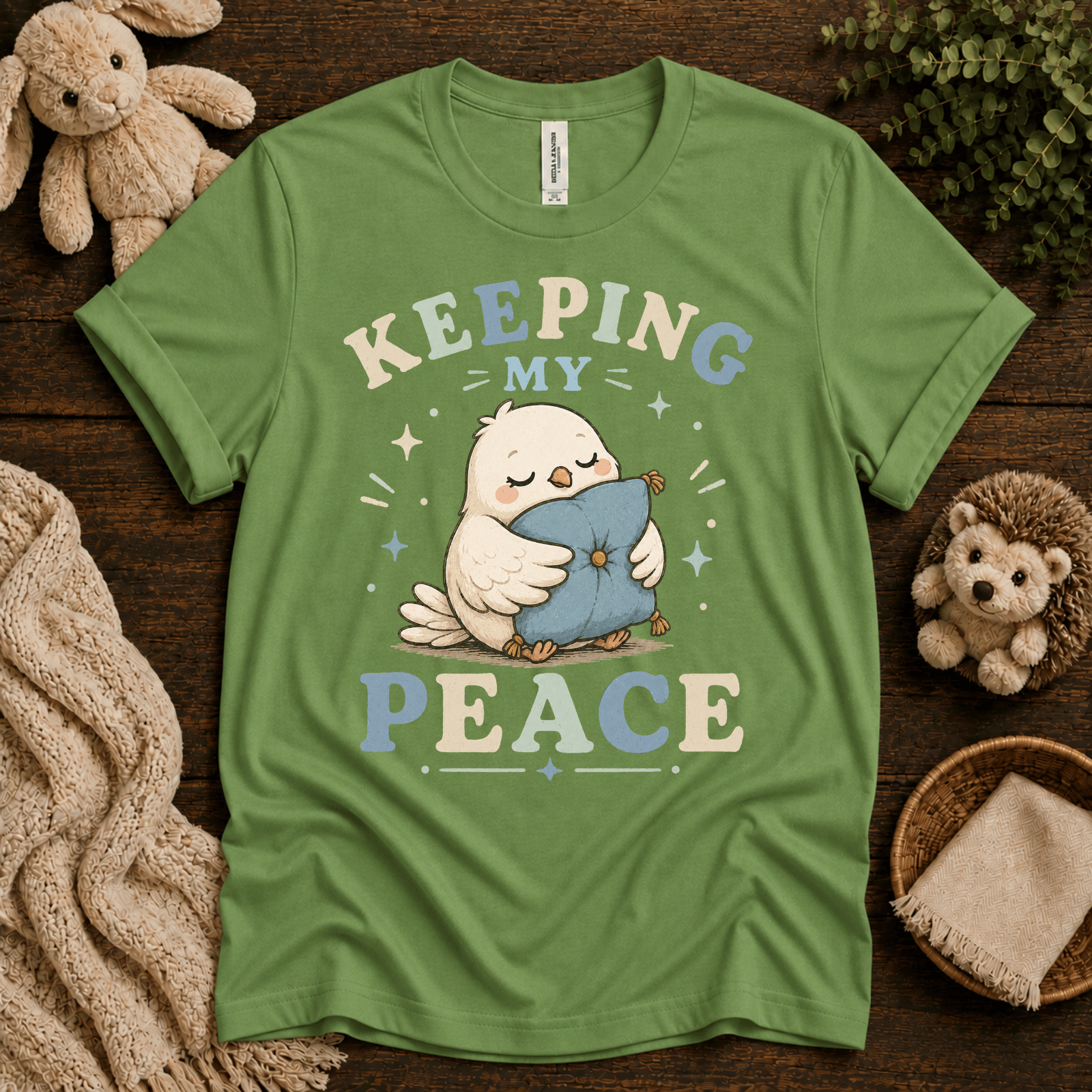 Keeping My Peace cute animal graphic t-shirt cozy flat lay in leaf.