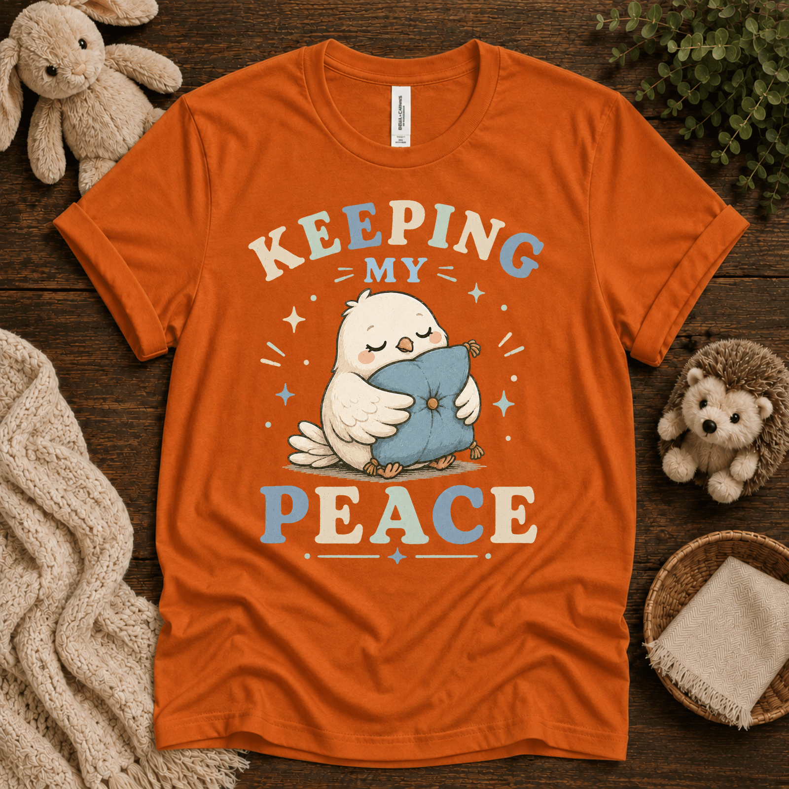 Keeping My Peace cute animal graphic t-shirt cozy flat lay in burnt orange.