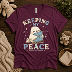 Keeping My Peace cute animal graphic t-shirt cozy flat lay in maroon.