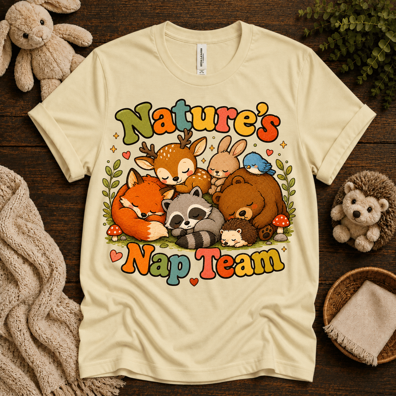Nature's Nap Team cute animal graphic t-shirt cozy flat lay in natural.