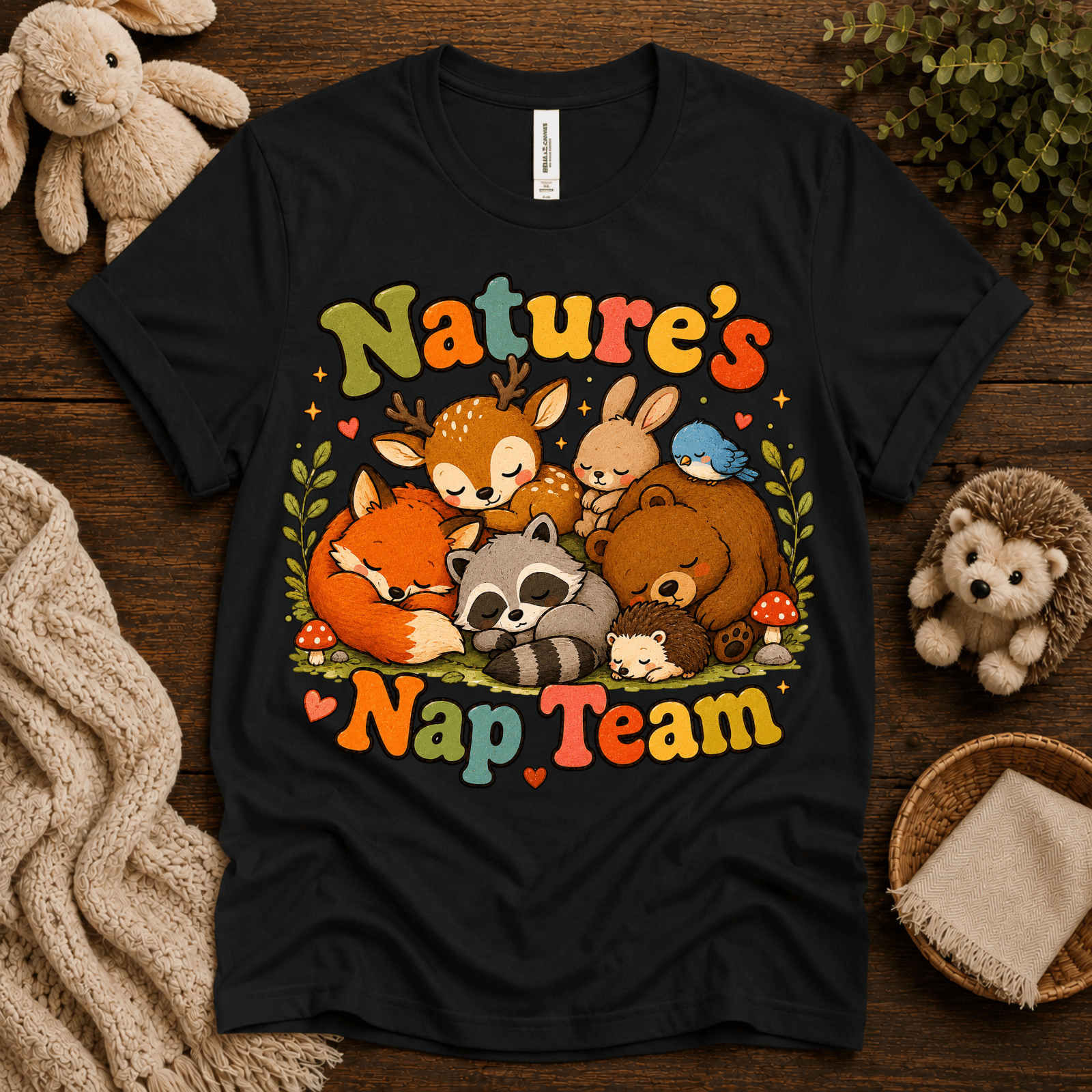 Nature's Nap Team cute animal graphic t-shirt cozy flat lay in vintage black.