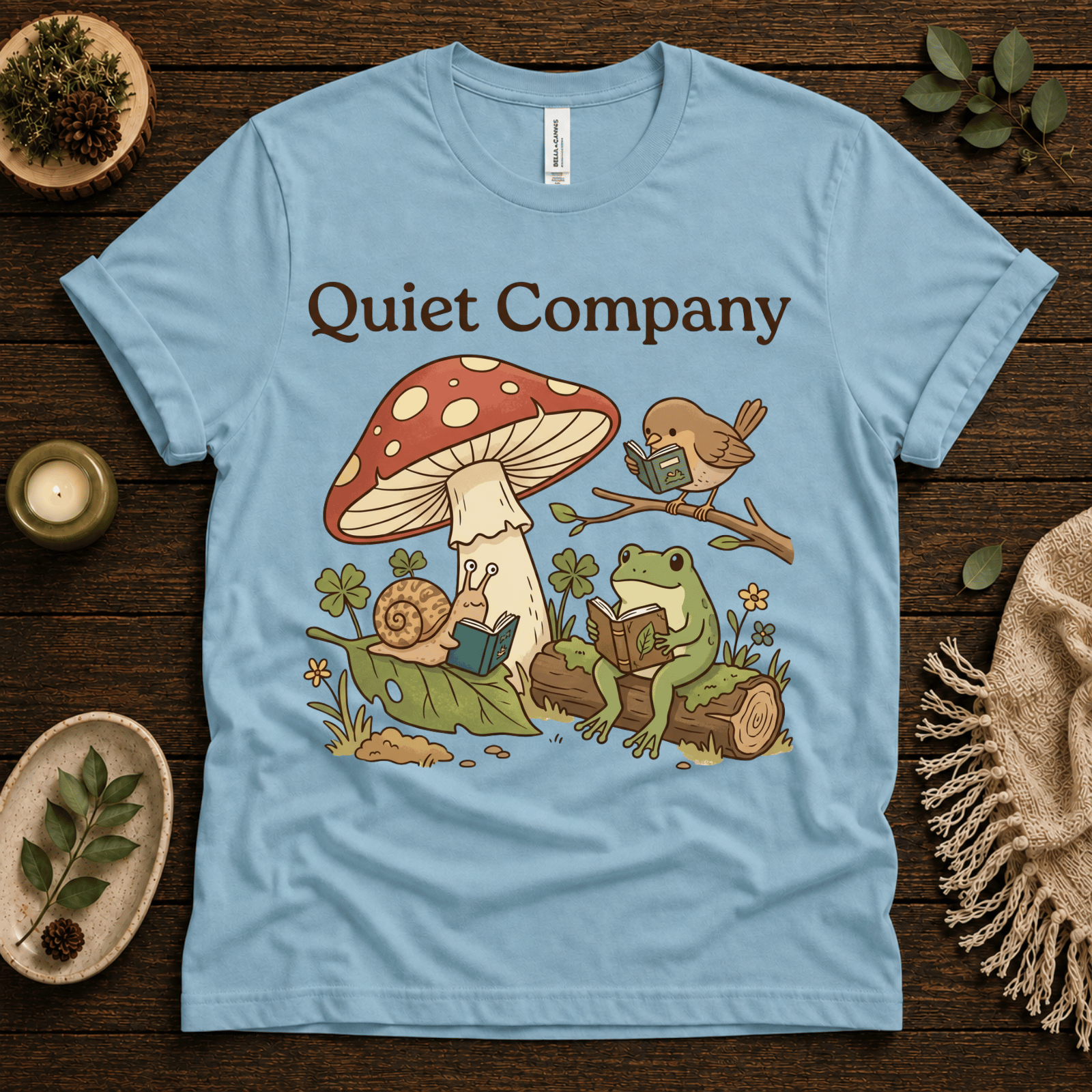 Quiet Company nature lover graphic t-shirt cozy flat lay in baby blue.