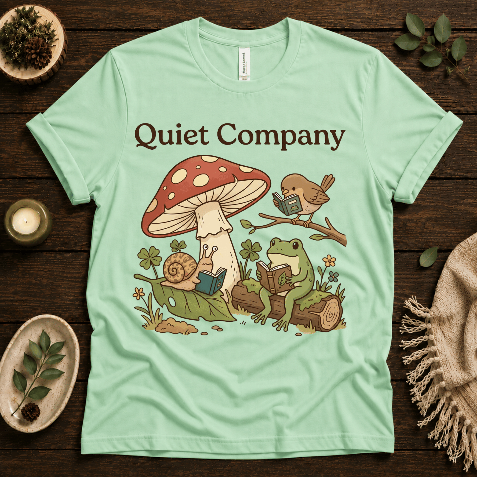 Quiet Company nature lover graphic t-shirt cozy flat lay in mint.