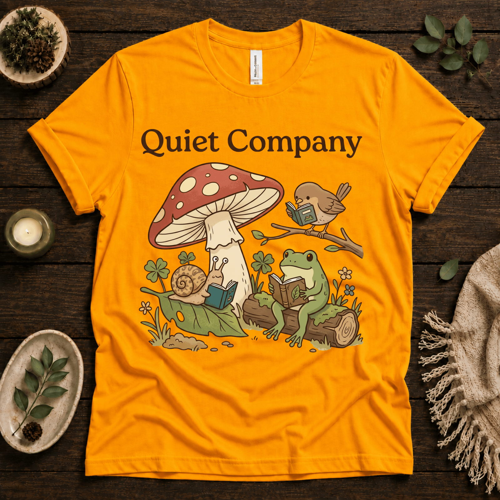 Quiet Company nature lover graphic t-shirt cozy flat lay in gold.
