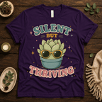 Silent But Thriving funny plant graphic t-shirt cozy flat lay in team purple.
