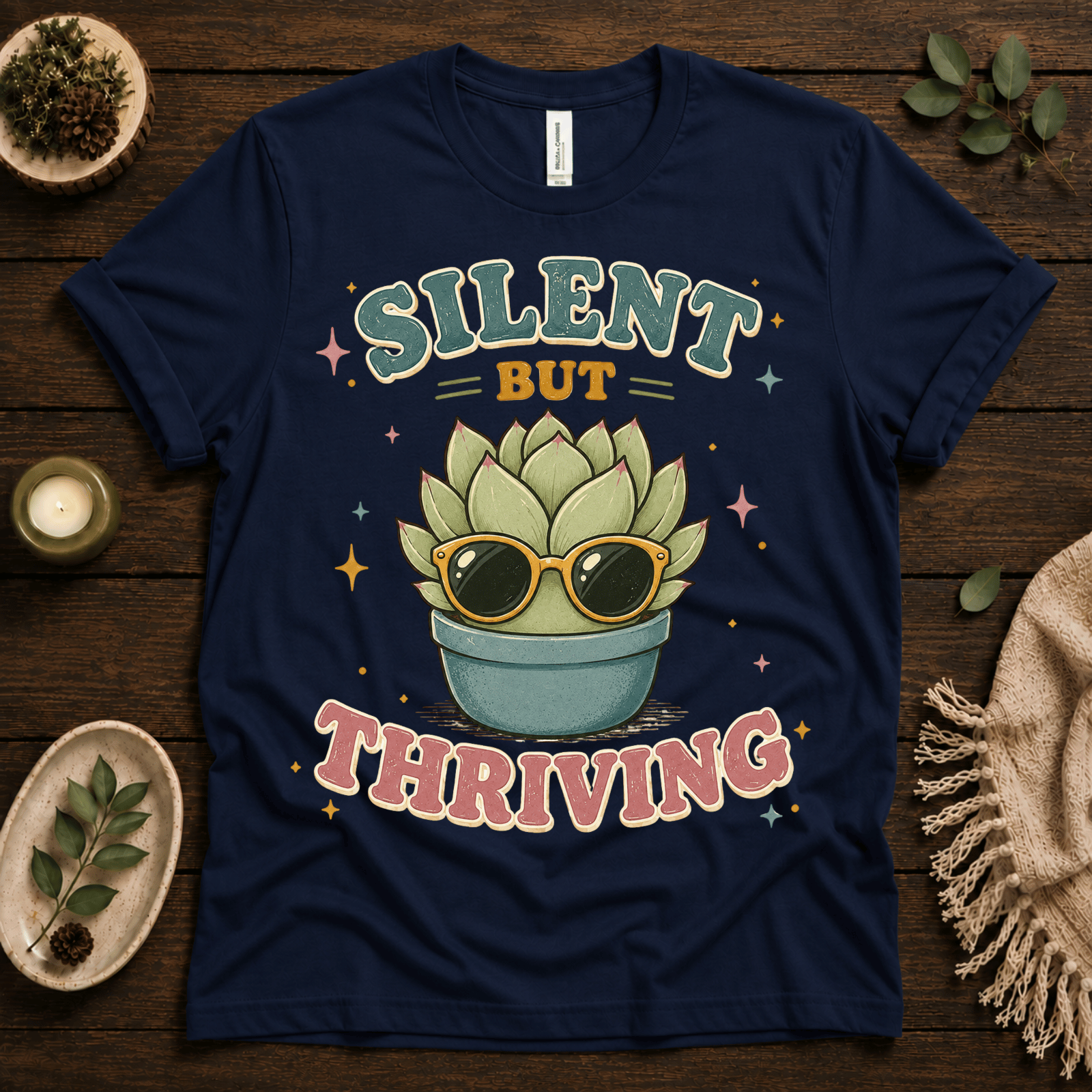 Silent But Thriving funny plant graphic t-shirt cozy flat lay in navy.