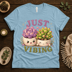 Succulent Vibing funny plant graphic t-shirt cozy flat lay in baby blue.