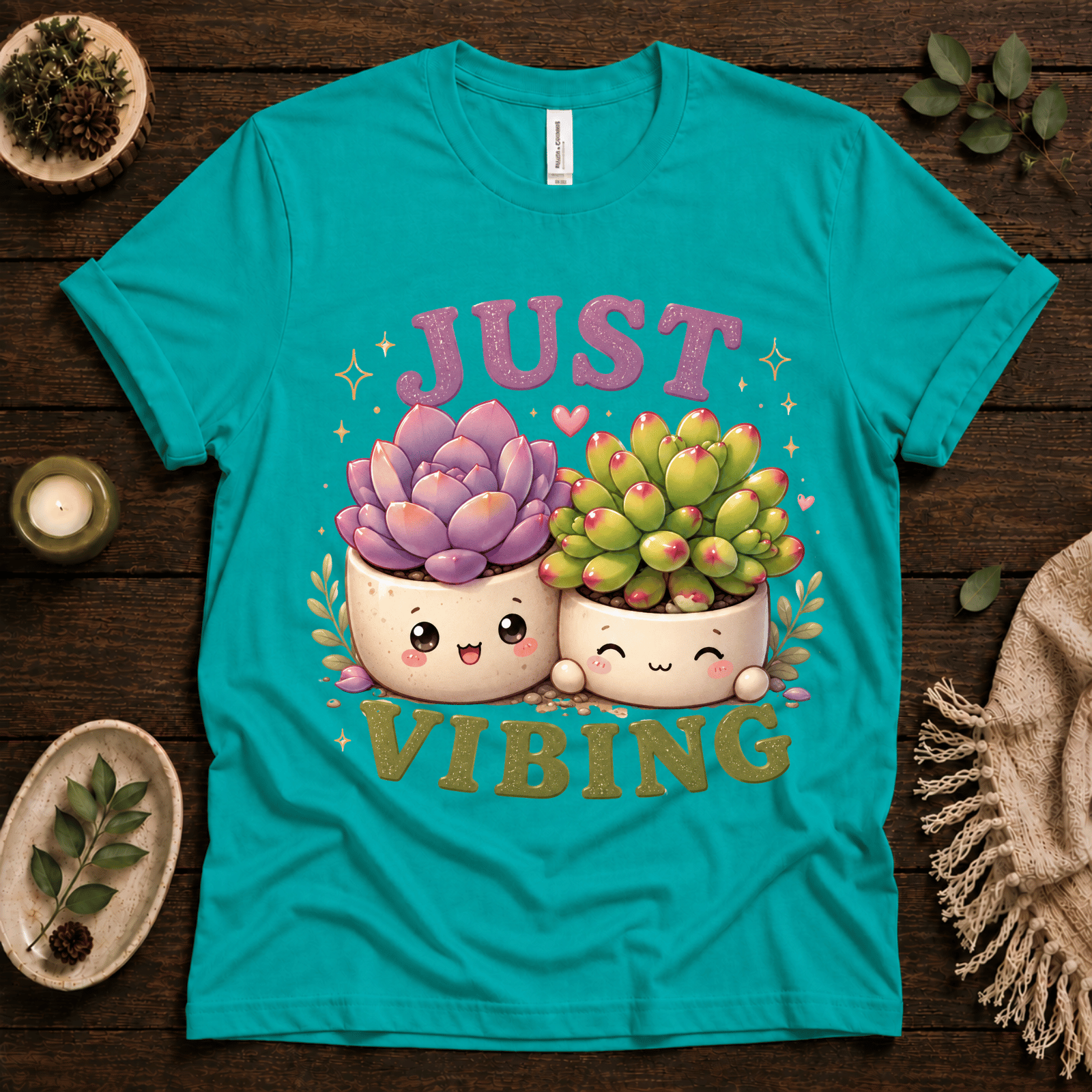 Succulent Vibing funny plant graphic t-shirt cozy flat lay in heather sea green.