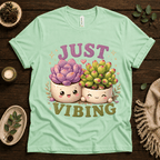 Succulent Vibing funny plant graphic t-shirt cozy flat lay in mint.