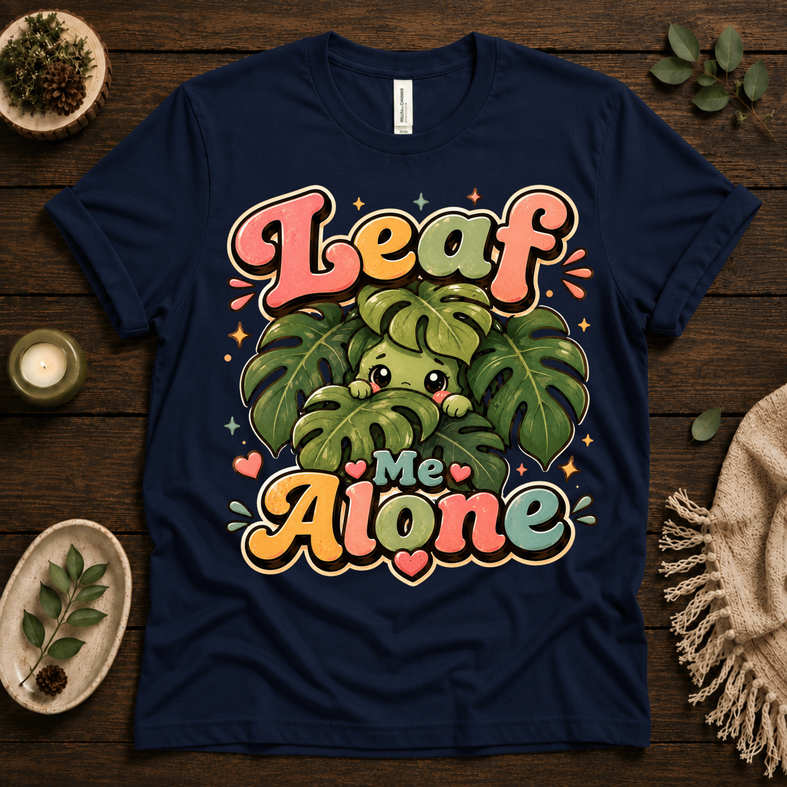 Leaf Me Alone funny nature graphic t-shirt cozy flat lay in navy.