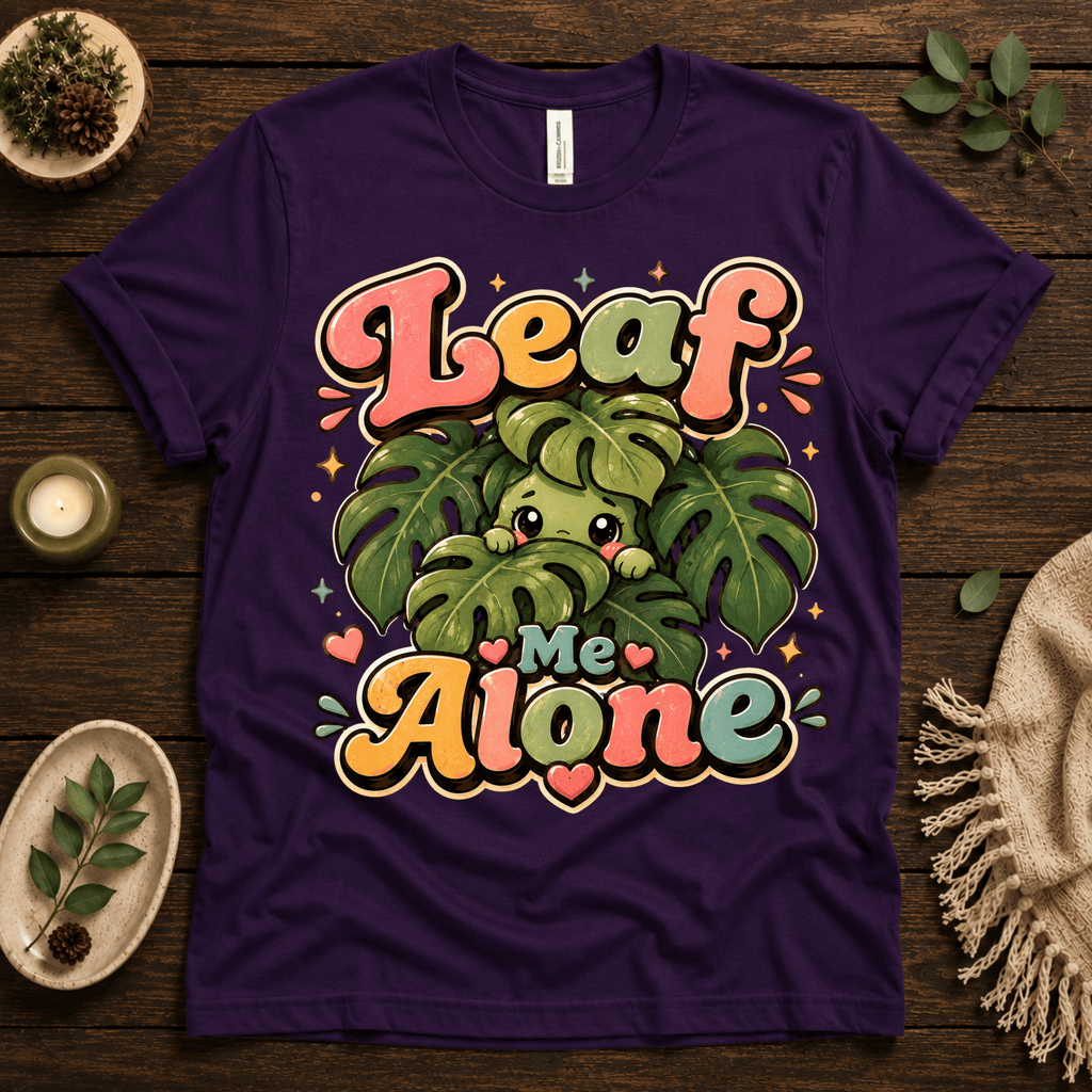 Leaf Me Alone funny nature graphic t-shirt cozy flat lay in team purple.