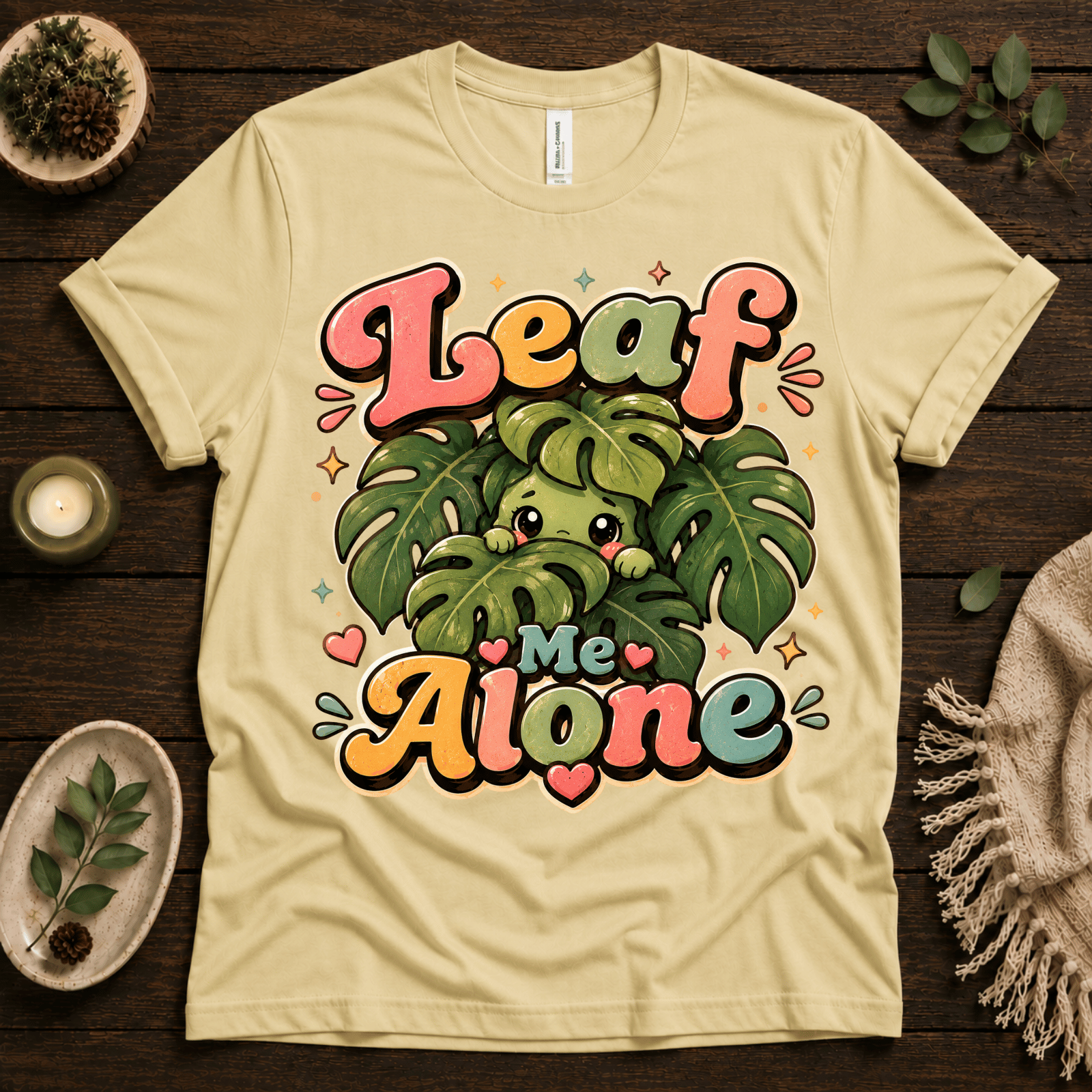 Leaf Me Alone funny nature graphic t-shirt cozy flat lay in natural.