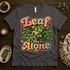Leaf Me Alone funny nature graphic t-shirt cozy flat lay in asphalt.