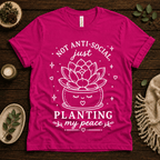 Planting My Peace cute plant graphic t-shirt cozy flat lay in charity pink.